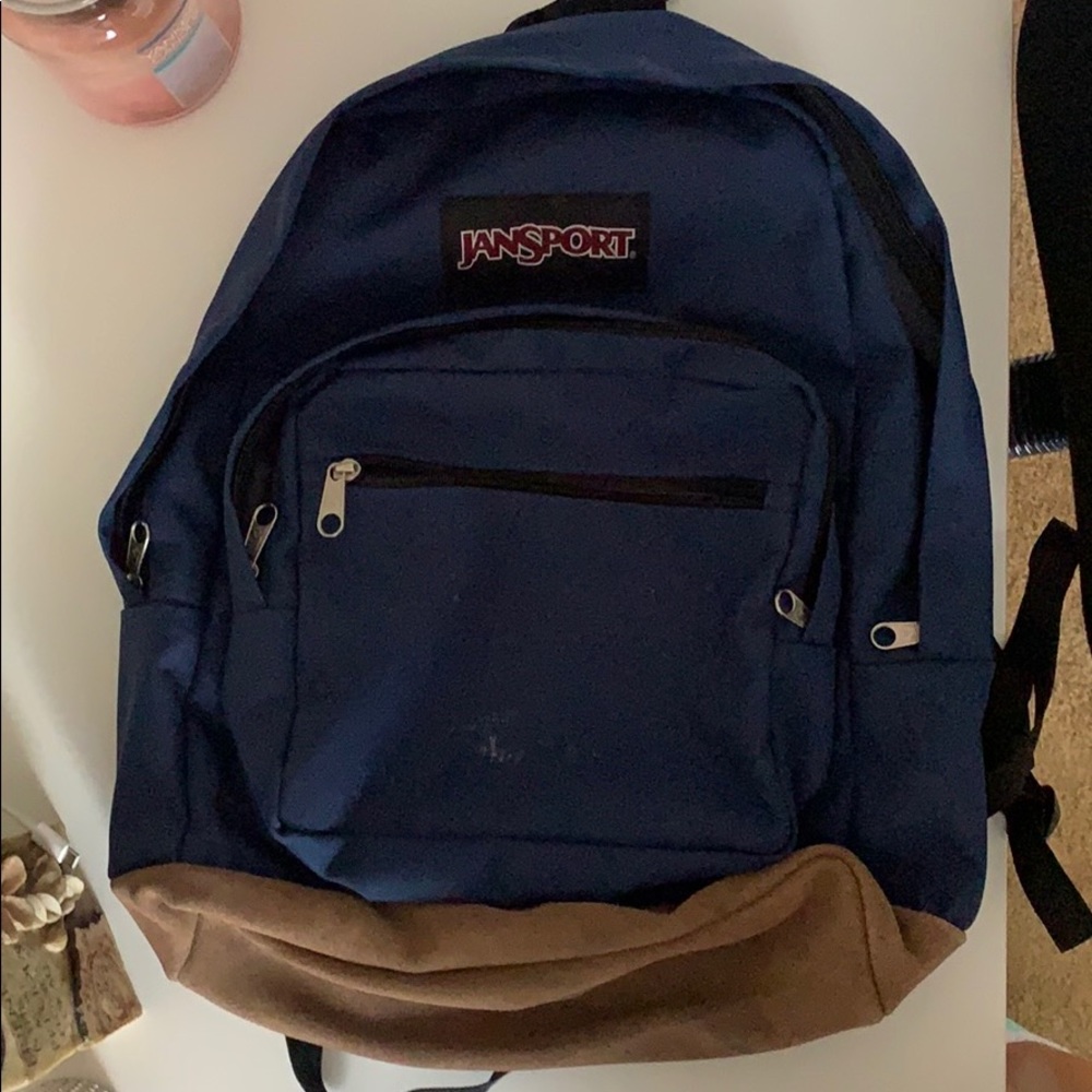 navy blue 3-pocket jansport backpack